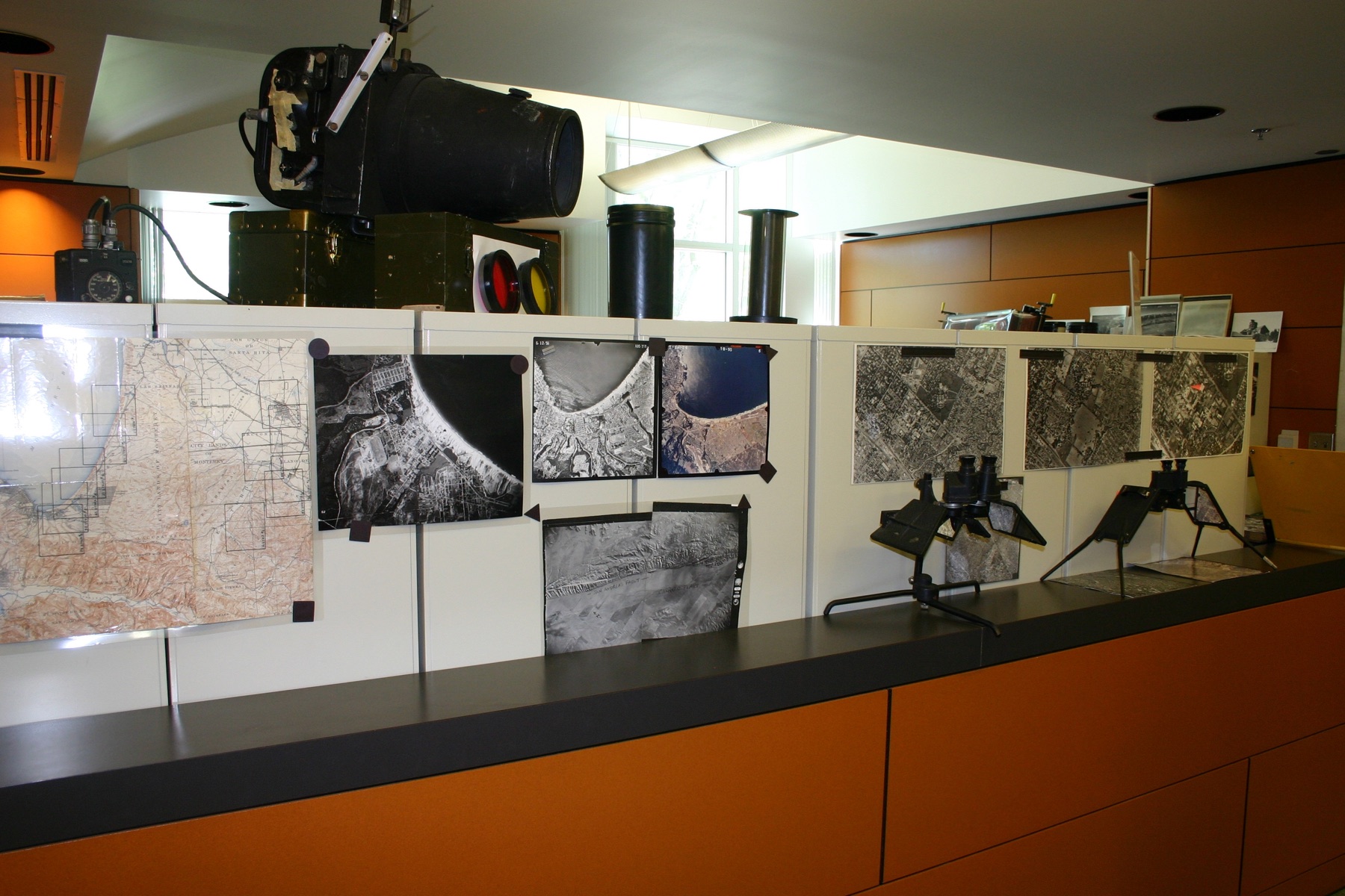 Researchers working with aerial imagery and technical equipment in the USGS Aerial Photography and Imagery Library